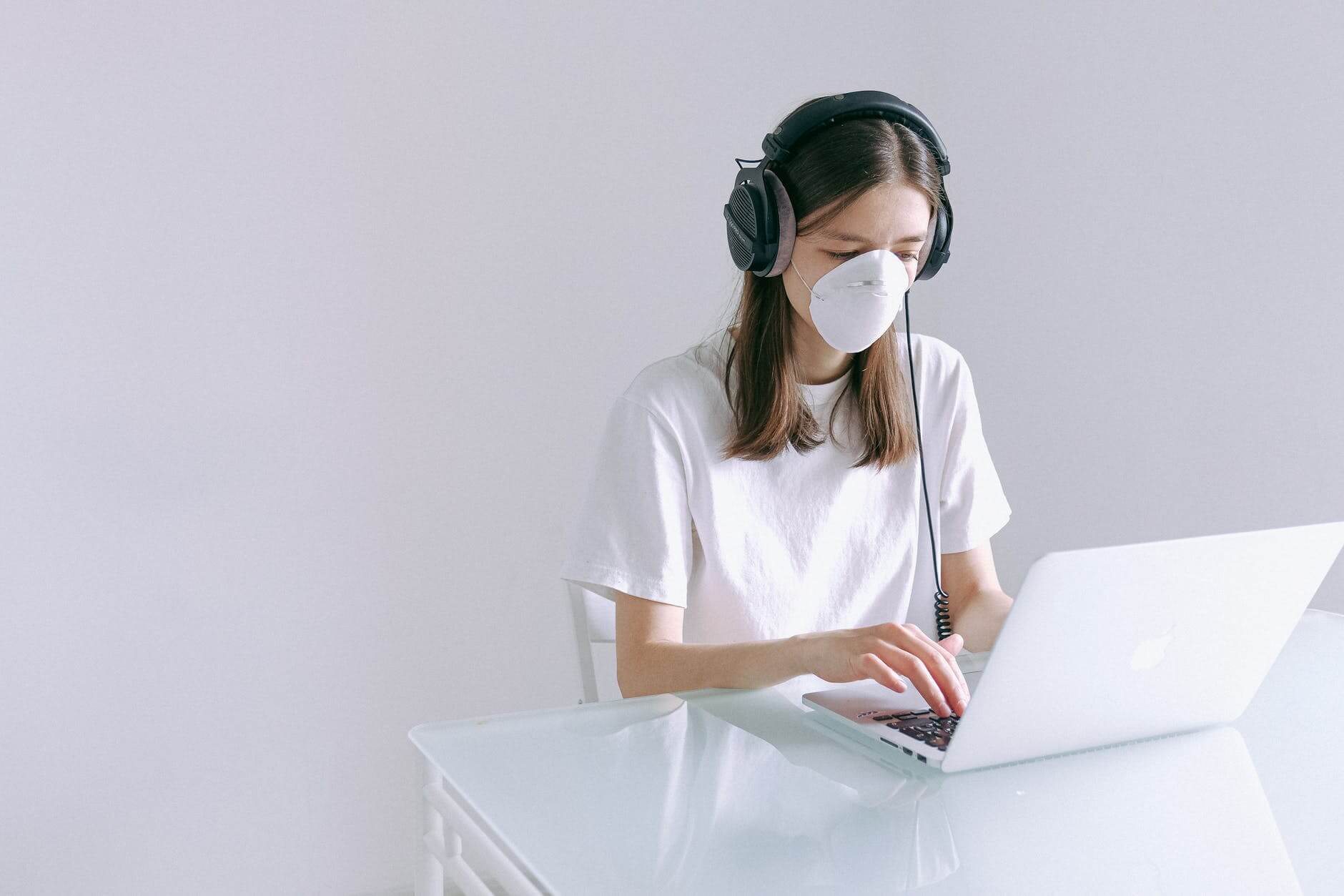 Woman With Mask on Laptop