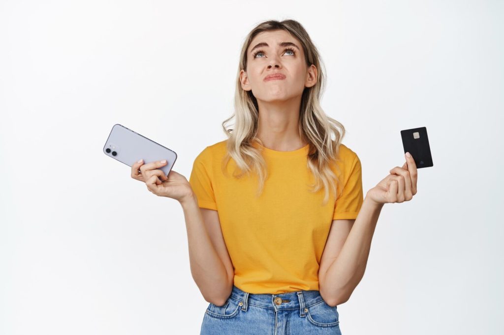 girl holding credit card 