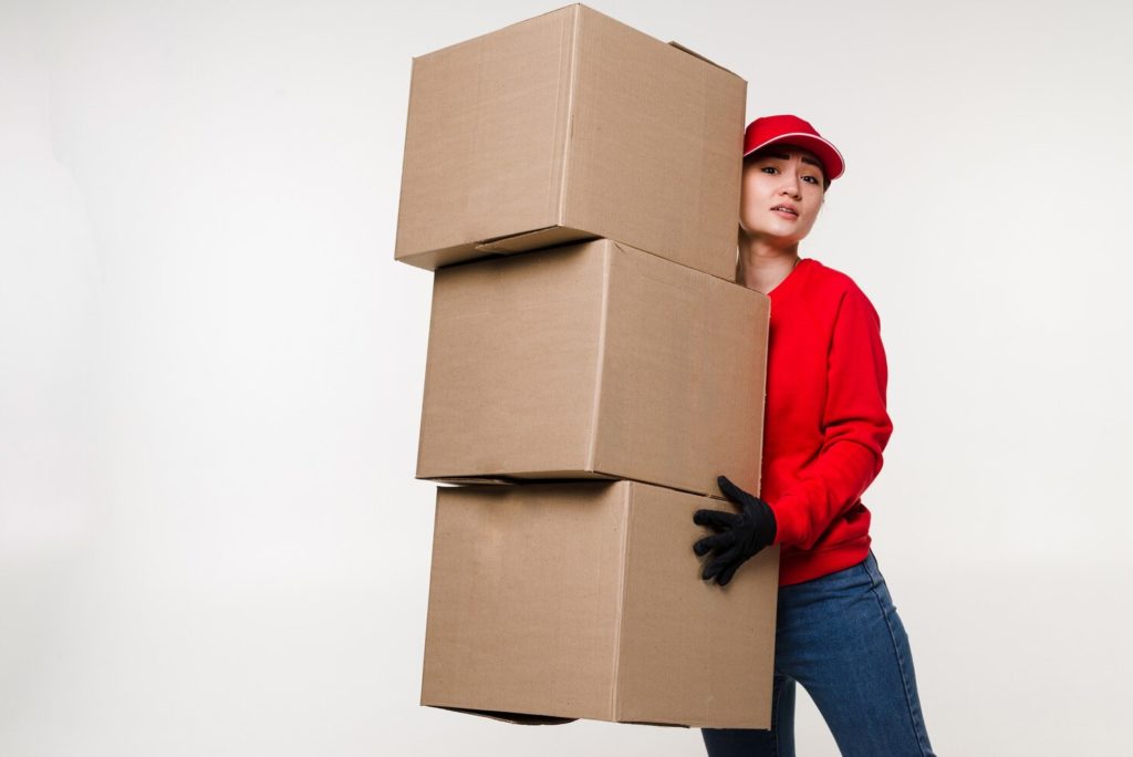 women carrying 3 boxes